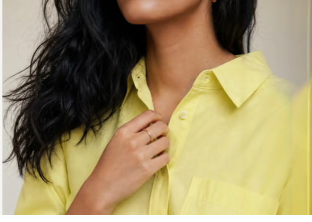 Close crop of a model wearing a yellow shirt